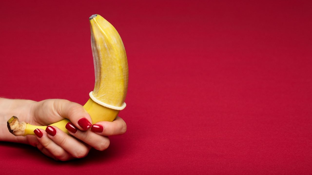 A condom as a symbol of protection against pregnancy and sexually transmitted infections